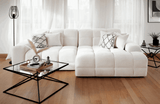 Elegant corner sofa in plush white fabric with decorative cushions for stylish living spaces