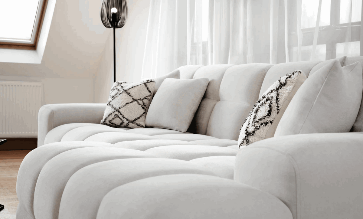 Stylish Corner Sofa in Light Grey Fabric with Decorative Cushions for Modern Living Spaces