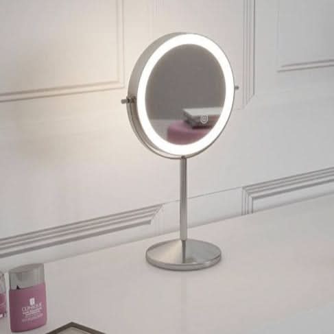 Hollywood Mirrors Cosmetic Mirror on a sleek stand with adjustable lighting for perfect makeup application