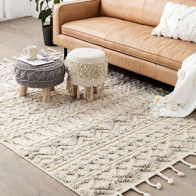 Nisu Home Cotton Rug in a modern living room under a stylish leather sofa
