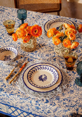 Casa by Josephine Jenno Cotton Tablecloth featuring floral pattern with elegant dinnerware and floral centrepiece