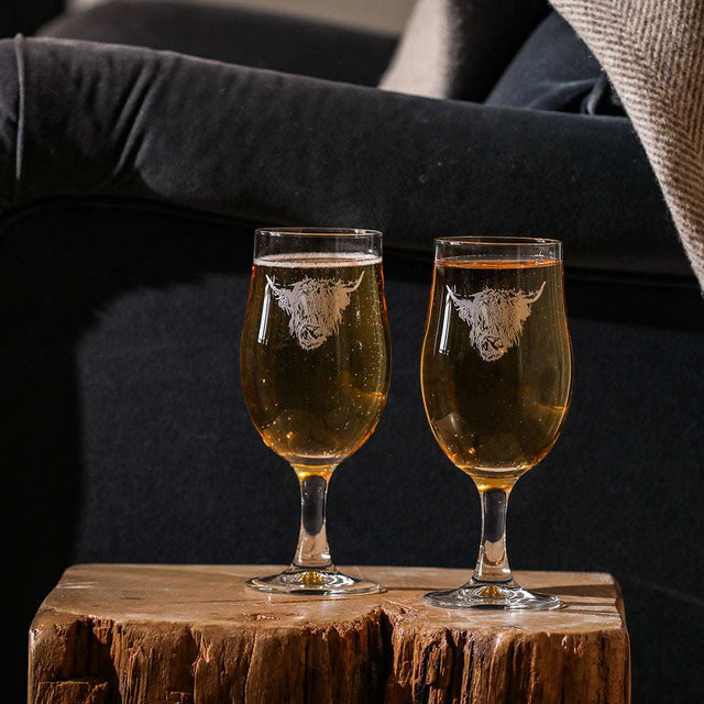 Selbrae House craft beer glasses featuring a highland cow design, perfect for enjoying your favourite brews.