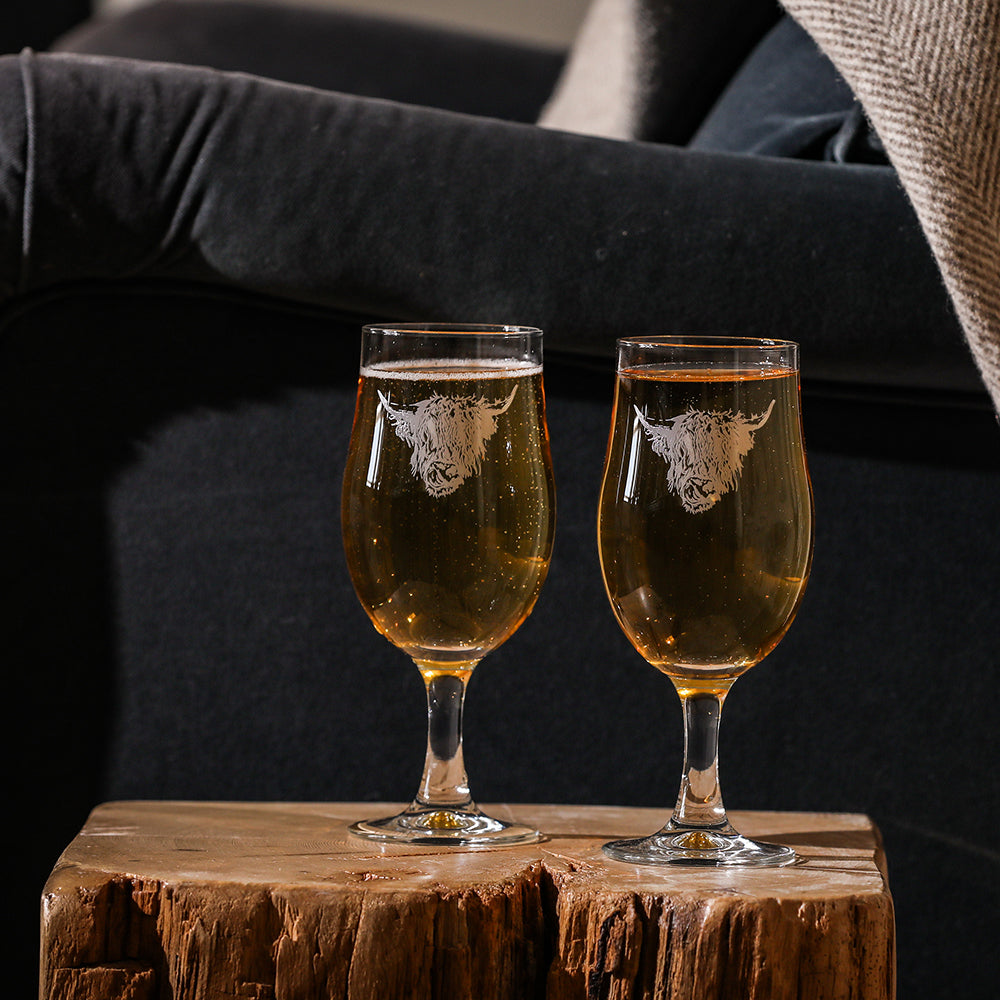 Selbrae House craft beer glasses featuring a highland cow design, perfect for enjoying your favourite brews.