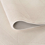 Soft cream rug with a textured geometric pattern, perfect for adding warmth to any room