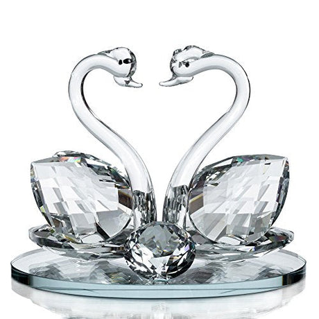 Elegant crystal glass swan figurine featuring two swans with a decorative base from London Boutique Lifestyle