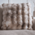Faux fur cushion in soft beige tones perfect for adding texture to any living space