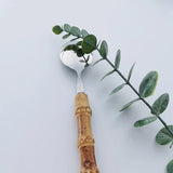 Nisu Home Cutlery Set featuring a stylish spoon with a bamboo handle and elegant design