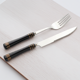 KitchBoom Cutlery Set featuring elegant black handles with gold accents for stylish dining