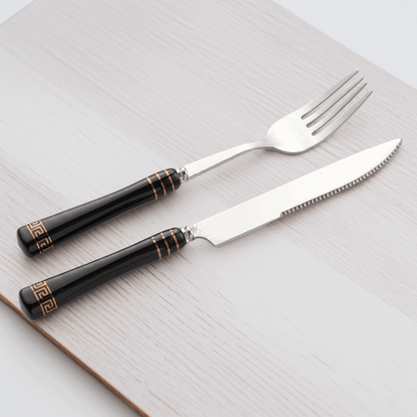KitchBoom Cutlery Set featuring elegant black handles with gold accents for stylish dining