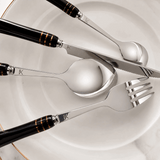 KitchBoom elegant cutlery set featuring stainless steel knife, fork, and spoon on a marble plate