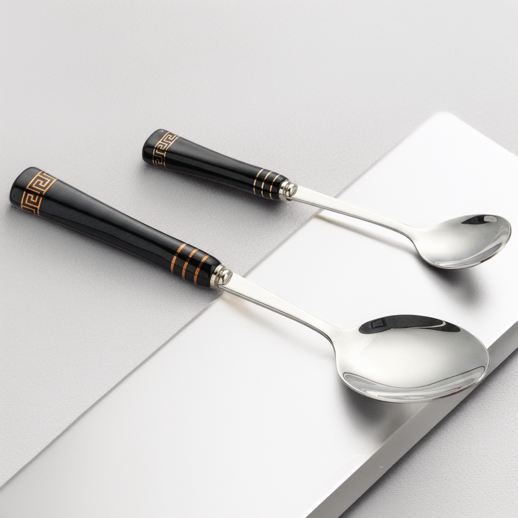 KitchBoom Elegant Cutlery Set featuring black handles with gold detailing and polished stainless steel spoons