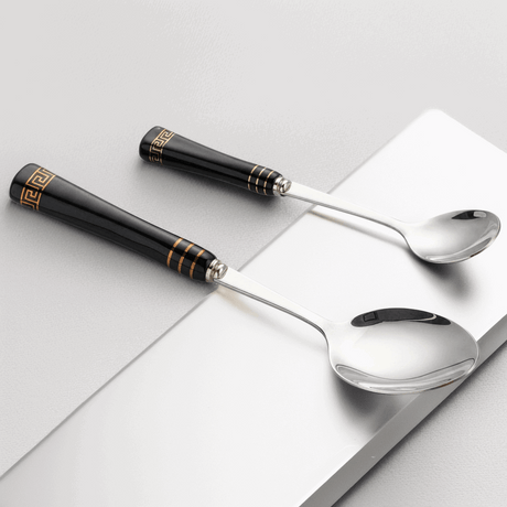 KitchBoom Elegant Cutlery Set featuring black handles with gold detailing and polished stainless steel spoons