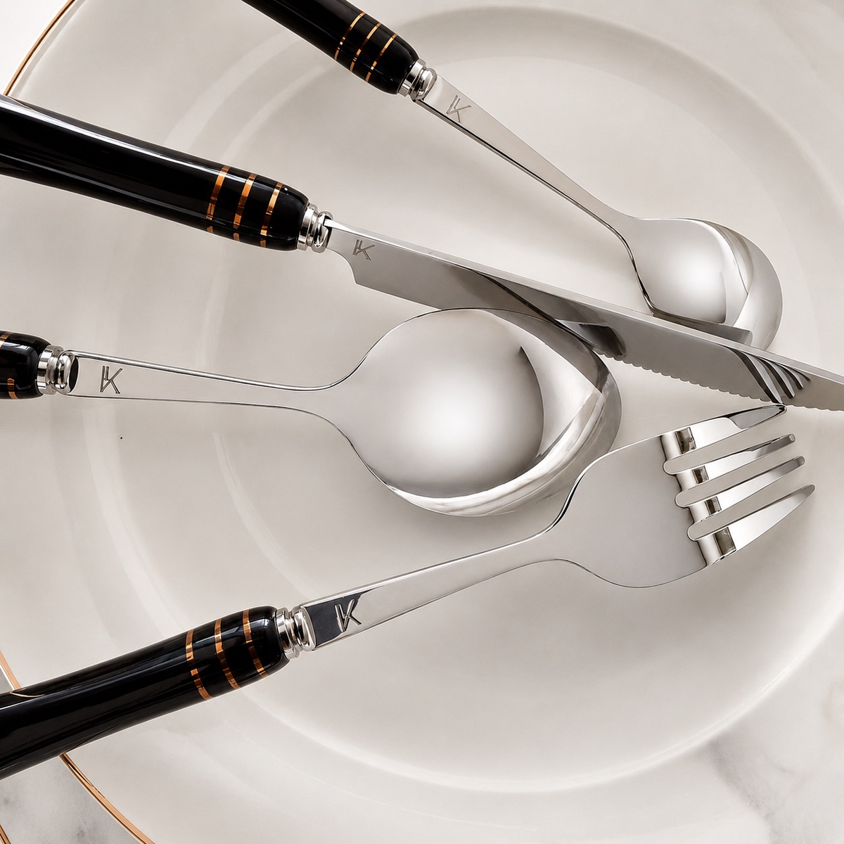 KitchBoom Cutlery Set featuring elegant stainless steel utensils with stylish black handles