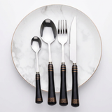 KitchBoom Elegant Cutlery Set with Black Handles on a Marble Plate for Dining Excellence