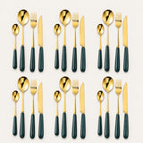 KitchBoom Cutlery Set in gold and black, featuring forks, knives, and spoons for elegant dining