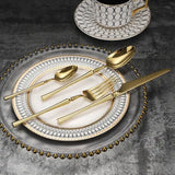 Elegant Nisu Home Cutlery Set in Gold on Decorative Plate for Stylish Dining Experience