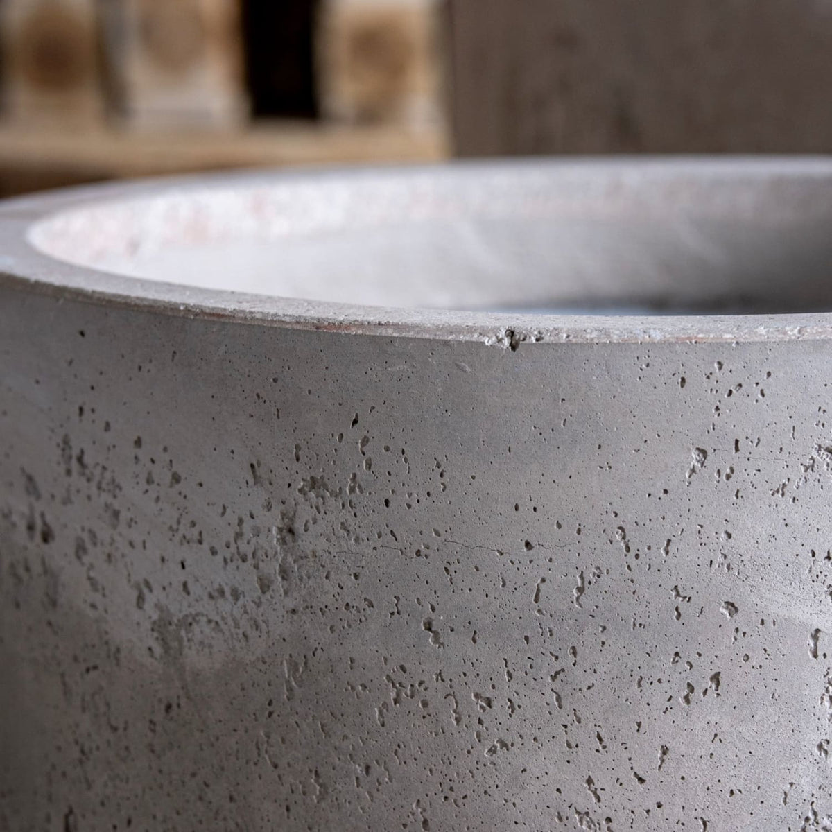 Close-up view of Jobu Home Cylinder Planter with textured concrete finish for indoor plants