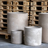 Set of grey Cylinder Planters in varying sizes, perfect for modern home decor