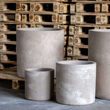 Set of grey Cylinder Planters in varying sizes, perfect for modern home decor