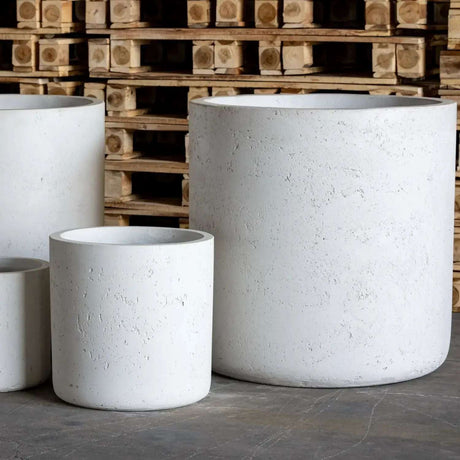 Set of white Jobu Home cylinder planters in various sizes for indoor and outdoor use