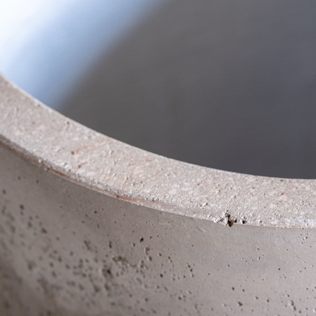 Close-up of a textured Cylinder Planter from Jobu Home, showcasing its minimalist design and natural finish