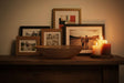 Orsina Decorative Bowl on Wooden Table Surrounded by Charming Photo Frames and Candles