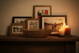 Orsina Decorative Bowl on Wooden Table Surrounded by Charming Photo Frames and Candles