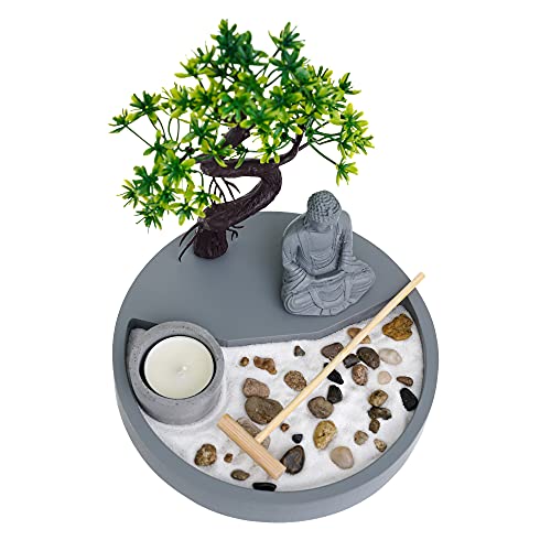 Decorative candle holder with a meditative scene featuring a statue, tree, and pebbles