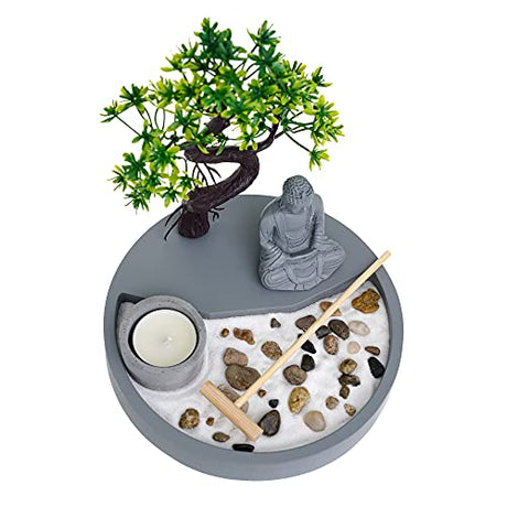 Decorative candle holder with a meditative scene featuring a statue, tree, and pebbles