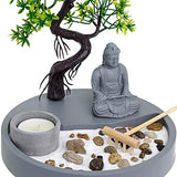 Elegant candle holder set with a Buddha statue, pebbles, and a miniature zen garden