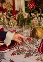 Festively decorated table featuring a Casa by Josephine Jenno cotton tablecloth with floral patterns