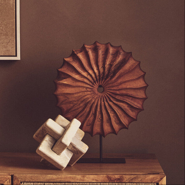 Unique Orsina sculpture featuring textured design on a stylish display stand for modern decor