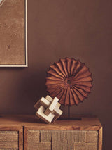 Orsina Sculpture in a modern design with a textured wooden ornament on a decorative table
