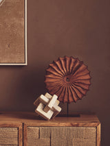 Orsina Sculpture in a modern design with a textured wooden ornament on a decorative table