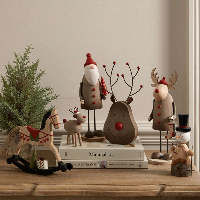Festive collection of Christmas room decorations featuring a snowman and woodland creatures