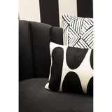 Orsina Diamond Design Cushion on a modern sofa with geometric patterns and bold colours