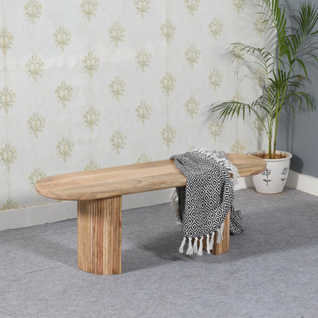 Verty Furniture Dining Bench in natural wood finish with soft blanket and decorative plant