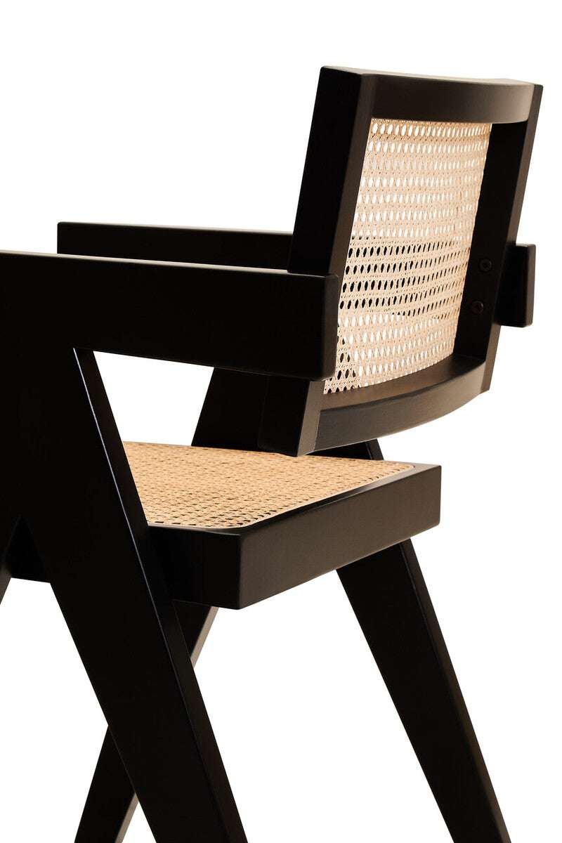 Orsina Dining Chair with a stylish black frame and woven cane backrest for modern interiors