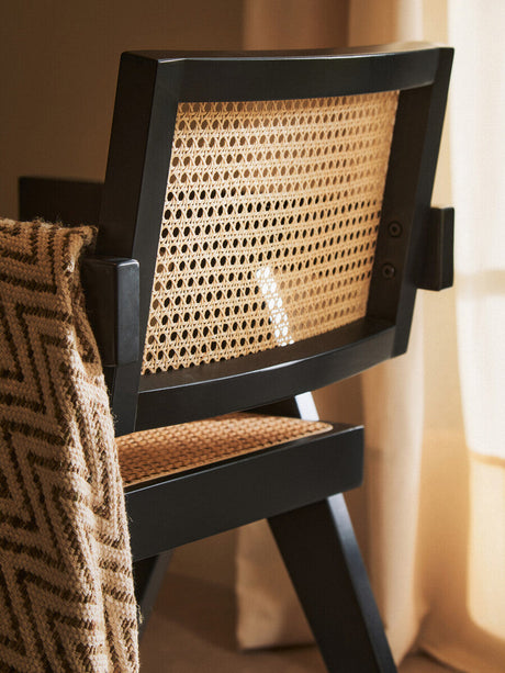 Orsina Dining Chair with a stylish cane backrest and sturdy wooden frame for modern interiors