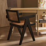 Orsina Dining Chair with a modern design featuring a black frame and woven seat for stylish dining