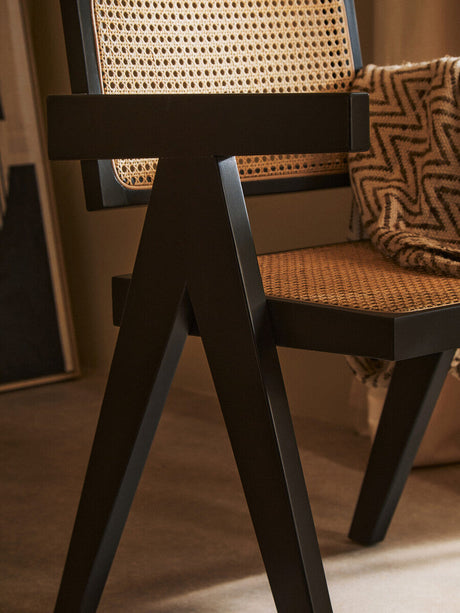 Orsina Dining Chair with Black Wood Frame and Woven Rattan Seat for Modern Interiors