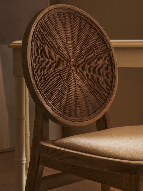 Orsina Dining Chair with a round woven back and cushioned seat for stylish dining