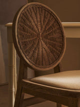 Orsina Dining Chair with a round woven back and cushioned seat for stylish dining