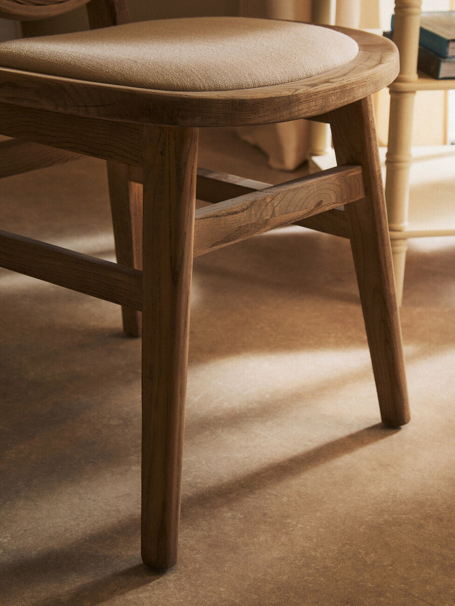 Orsina Dining Chair with a smooth wooden frame and cushioned seat for comfortable dining