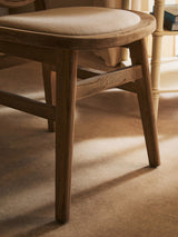 Orsina Dining Chair with a smooth wooden frame and cushioned seat for comfortable dining