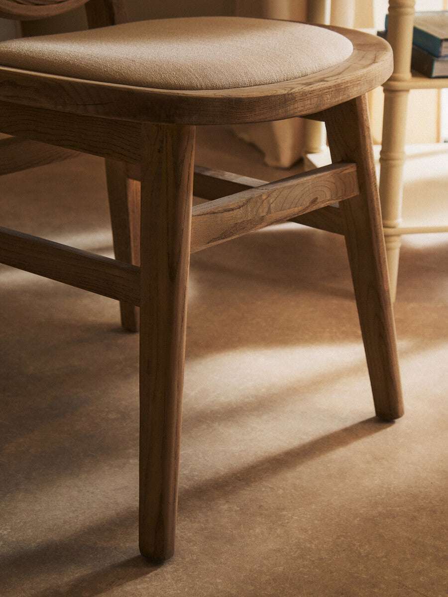 Orsina Dining Chair with a smooth wooden frame and cushioned seat for comfortable dining