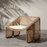 Stylish Nisu Home Dining Chair in woven rattan with a comfortable white seat cushion