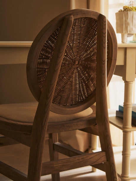 Orsina Dining Chair with a Circular Rattan Backrest and Wooden Frame for Elegant Dining Spaces