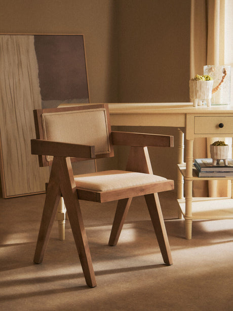 Orsina Dining Chair with a wooden frame and upholstered seat, perfect for stylish interiors