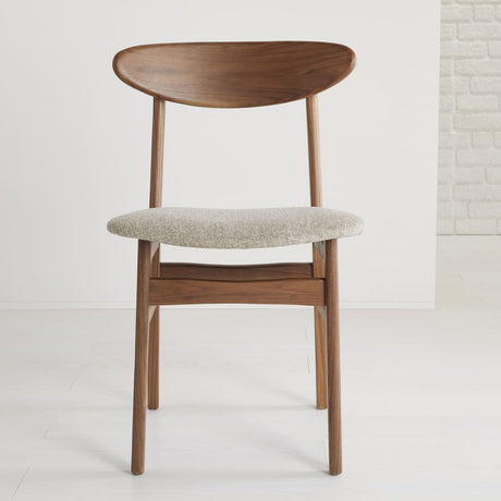 Elegant Fishe and Lilly Dining Chair with a wooden frame and soft fabric seat for modern interiors